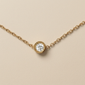 Close-up of the Morning Light Solitaire Necklace and round cubic zirconia pendant