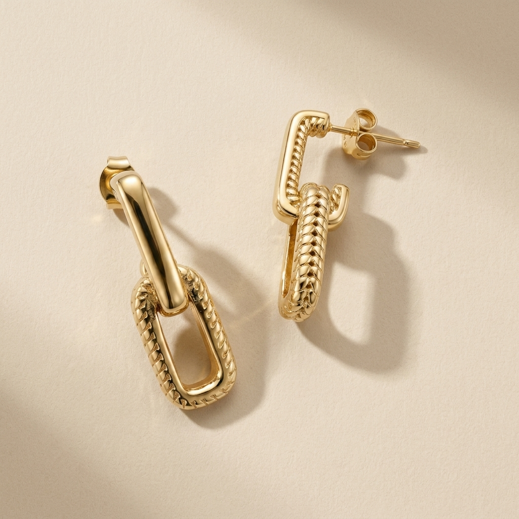 Pair of sculptural Travertine Link Earrings with polished interlocking gold shapes