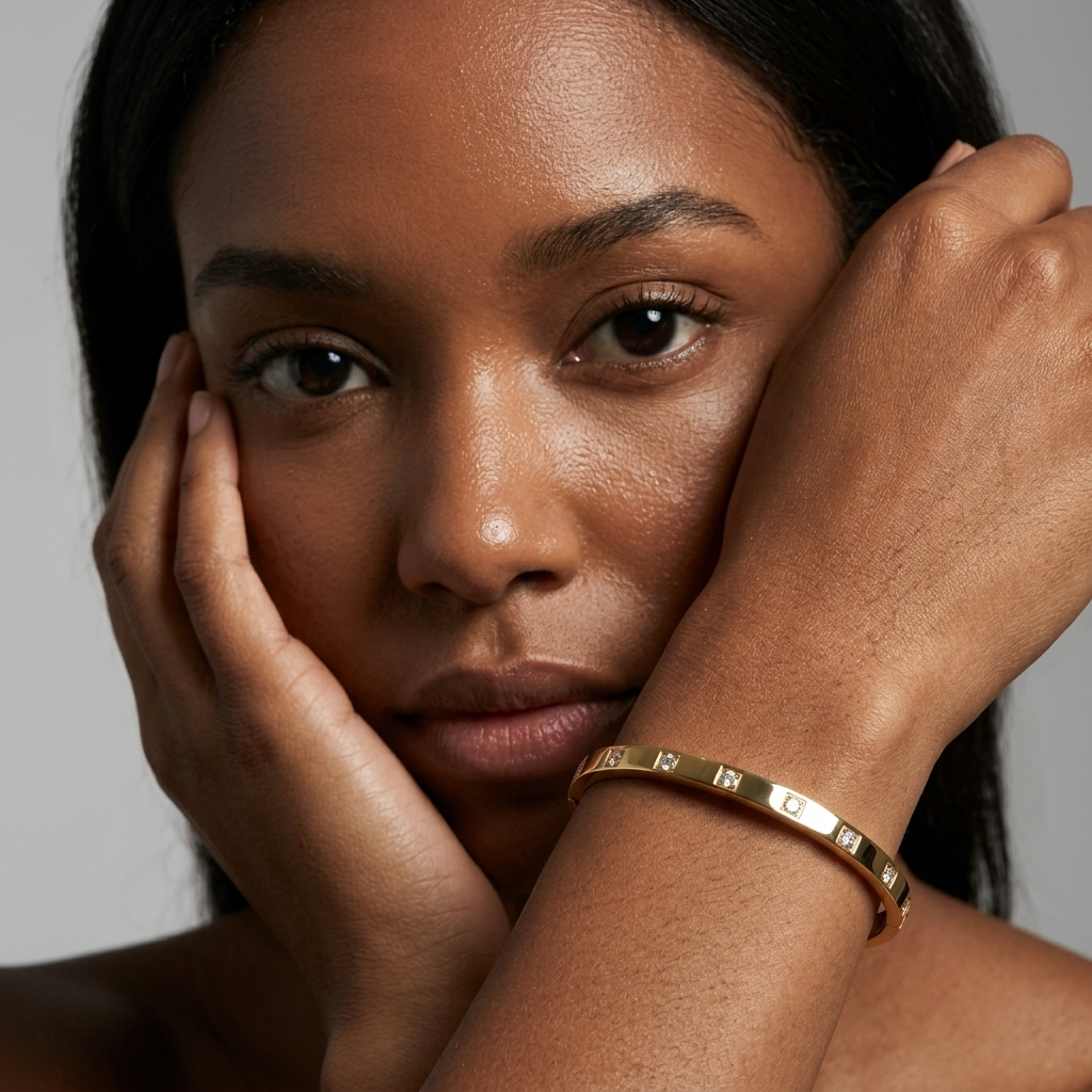 Model wearing the Whitecliff Crystal Bangle with hands raised near her face