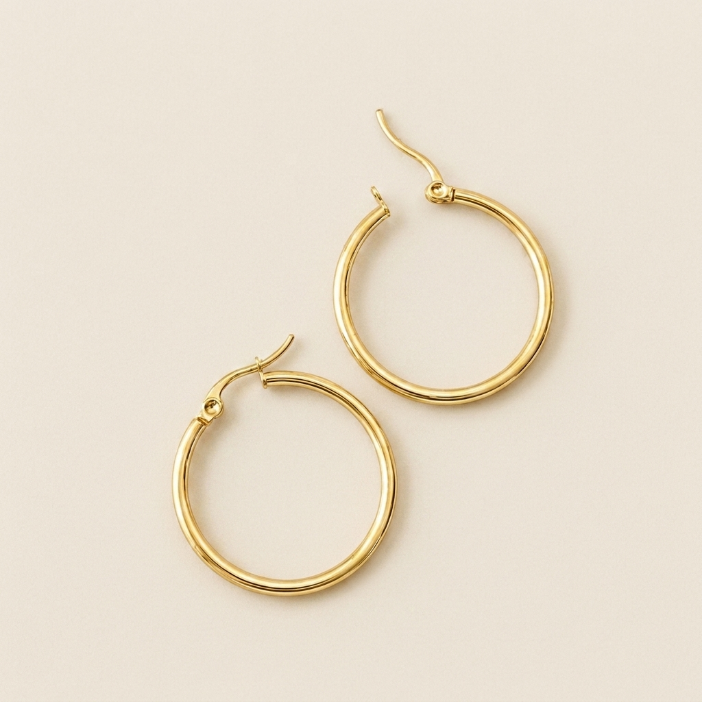 Meadow Hoop Earrings laid flat to show their fine circular shape and pin closures