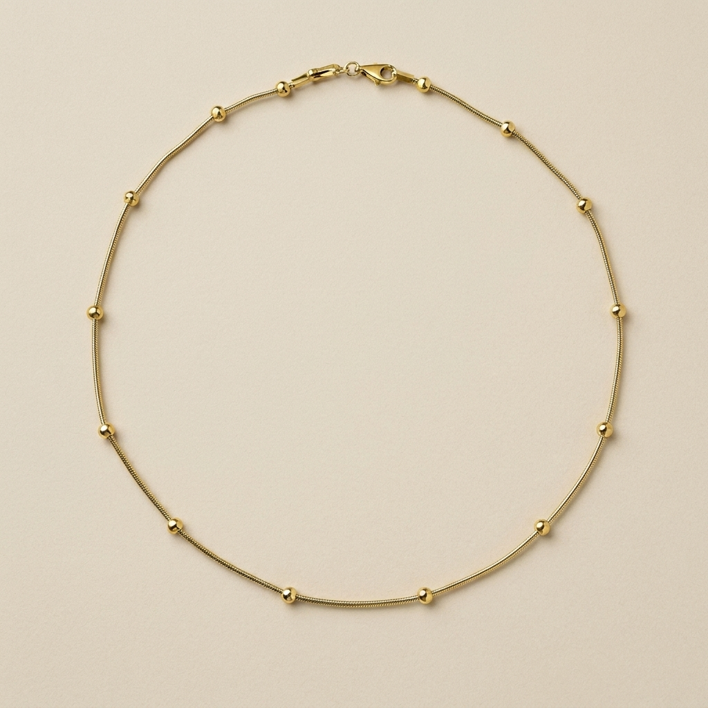 Celestial Bead Necklace laid flat to show its fine chain and polished bead stations